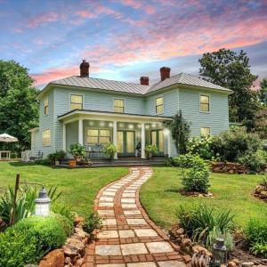 Welcome home to this completely restored historic property, nestled on land once part of a 2000-acre orchard and farm.  Meandering to the rocking chair front porch, a path of hand-gathered fieldstones adds timeless character and connection to it's rich past!