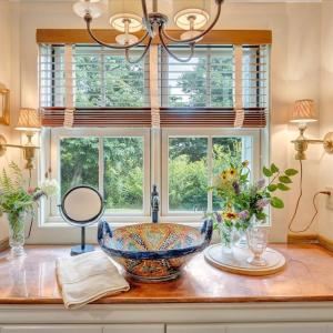 Handmade Mexican salad bowl used as sink.  Copper countertop. Original dresser retrofitted as vanity underneath.