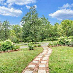 Fig trees, cherry trees, Japanese Maple, and other ornamentals along with perennials throughout property burst with life year-round!