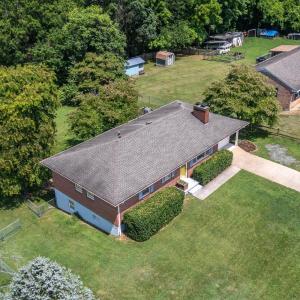 Aerial view of the front of the house and yard