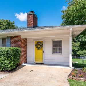 Front door leading into den