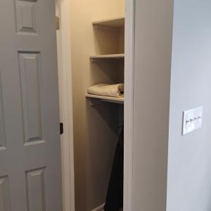 Small closet in master at entrance