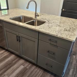Kitchen --Granite topped work island/breakfast bar w/ double undermount sink