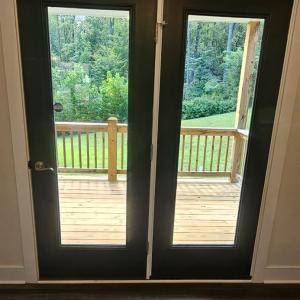 French doors in DR lead to covered deck