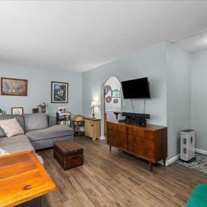 The stairs going down to the lower level are here off the LR.