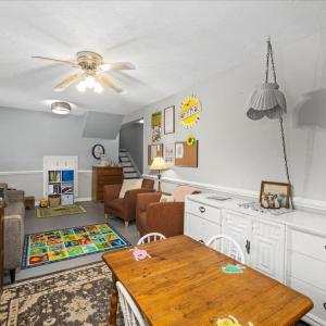 Behind the bookcase on the far wall is a TON of space in the water-proofed crawlspace (Toler Insulation)
