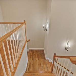 Dual staircase to foyer and back staircase to kitchen