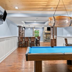 More tongue and groove ceiling over pool table area