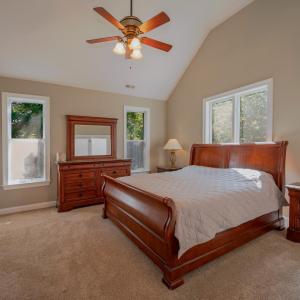 Primary bedroom w/ 14+- ft ceilings