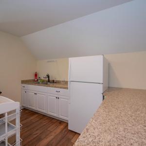 Kitchen in finished area above garage