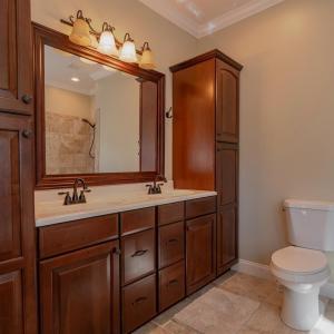 Primary bath w/ 2 built in linen cabinets, double sink vanity