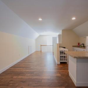 Approx 640 sq ft of finished area above garage includes a living room area, kitchen, full bath, mini split heat pump