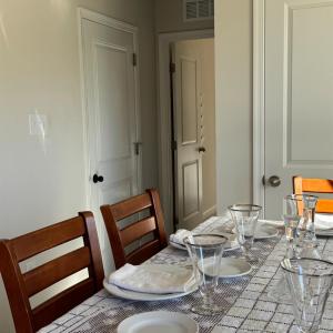 Pantry cupboard on the right, garage door on the left, down the hall is the main floor half bath and past that, the office