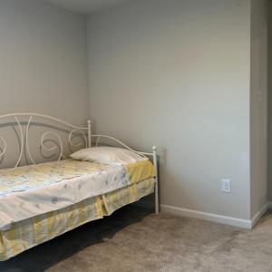 Bedroom 4 flanking the hall bath and large linen closet with Bedroom 3 on the other side.