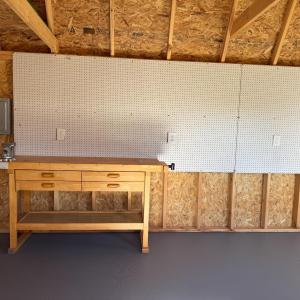 The shed is fully electrified and the workbench conveys also