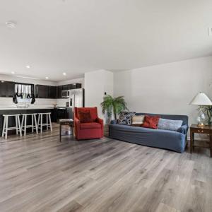 The light from the full glass back door to the full wall of windows in the front of the house creates a wonderful comfortable feeling