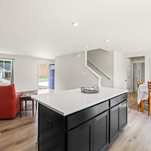 The large and handy island has seating on the back side.