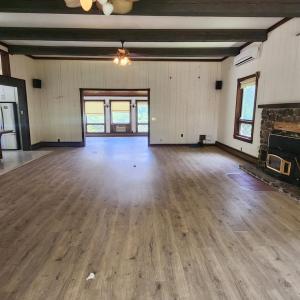 Open Living Room/Entertainment area with fireplace