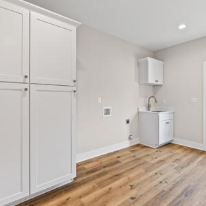 Large laundry room with side entrance.  Great drop zone and lots of extra storage!