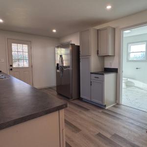 The downstairs full bath is located right off the kitchen