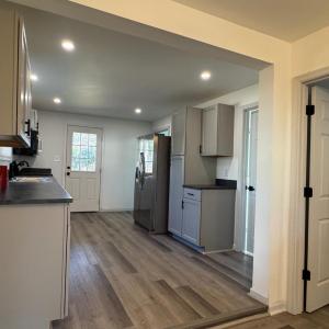 The downstairs bedroom is right off the "Dining Room area just before the kitchen