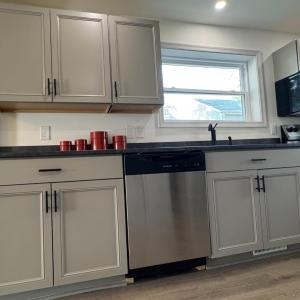 Really pretty and well-lit kitchen! The picture window at the sink is a delight.