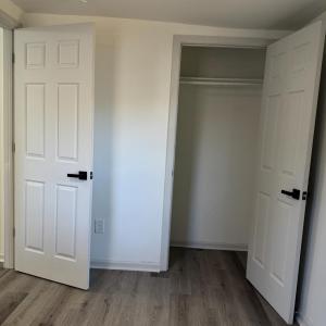 Bedroom 3 closet and door to hallway