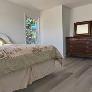 This room has a window on the front and a window on the side for light and views of pretty foliage!