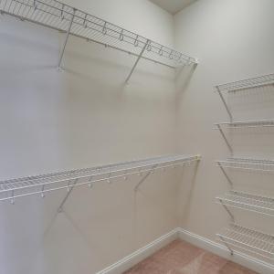 Walk-in closet in primary bedroom