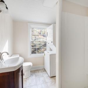 Main level bathroom with stackable W/D