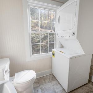 Main level bathroom with stackable W/D