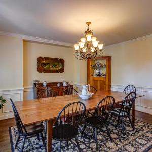 Spacious dining room off kitchen with custom plantation blinds!
