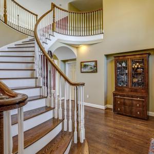 Grand staircase with balcony overlooking formal living room!