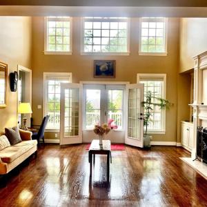 Gorgeous entry to formal living room with gas logs and lots of natural light!