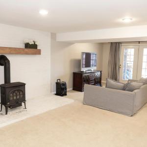 partially finished basement with wood stove for extra warmth