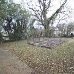 Large fenced in back yard that is tree lined for more privacy