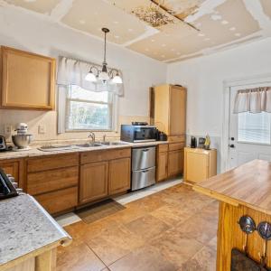 The driveway side door. Result of the leak in the back roof, as described~ it needs to be replaced