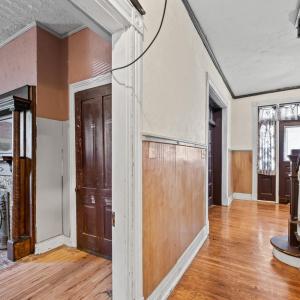 Continuing down the hallway we come to the DR. The door to the Den is visible here.