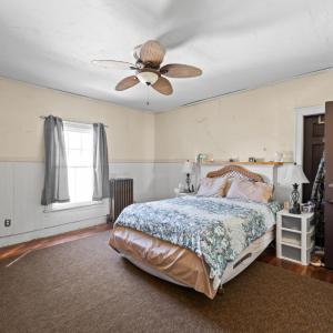 The bedroom on the back of the house behind bedroom 2. The passthrough door can be seen just behind the entrance door here.