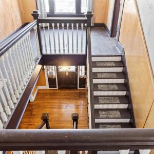 Stopping at the top of the stairs too look down at the nice view of the foyer below.