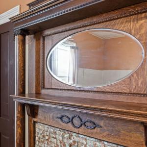 Another beautiful mantle. Showing here also is a regular sized closet and a hutch type closet on the driveway side wall.