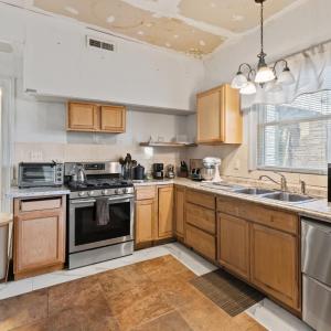 The exterior door in mudroom through doorway. Tile floor. The kitchen is on the back of the house. Appliances do not convey.