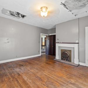 Bedroom 2 is also on the front of the house. This is where the roof on the front needs to have the leak fixed. the door on the right is the closet. There is another passthrough door to the room behind this one just behind this room's entrance door.