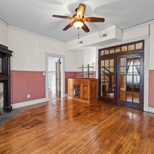 French door to the foyer, passthrough door to the Family room, box of tiles conveys for the fireplace surround