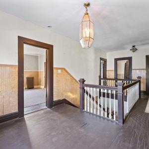 Upstairs and going into the first bedroom at the top of the stairs.