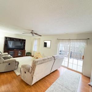 Living room on main level with patio doors to deck.