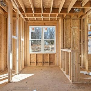Primary suite bathroom with walk-in tile shower, stand alone tub.