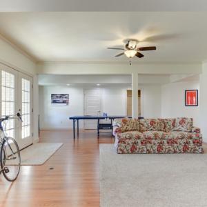 Lower level den, spacious, airy, leading to patio.