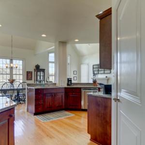 Custom kitchen, gas range, upgraded appliances; pantry, main level laundry room