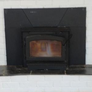 WOOD STOVE INSERT IN MAIN LEVEL DEN